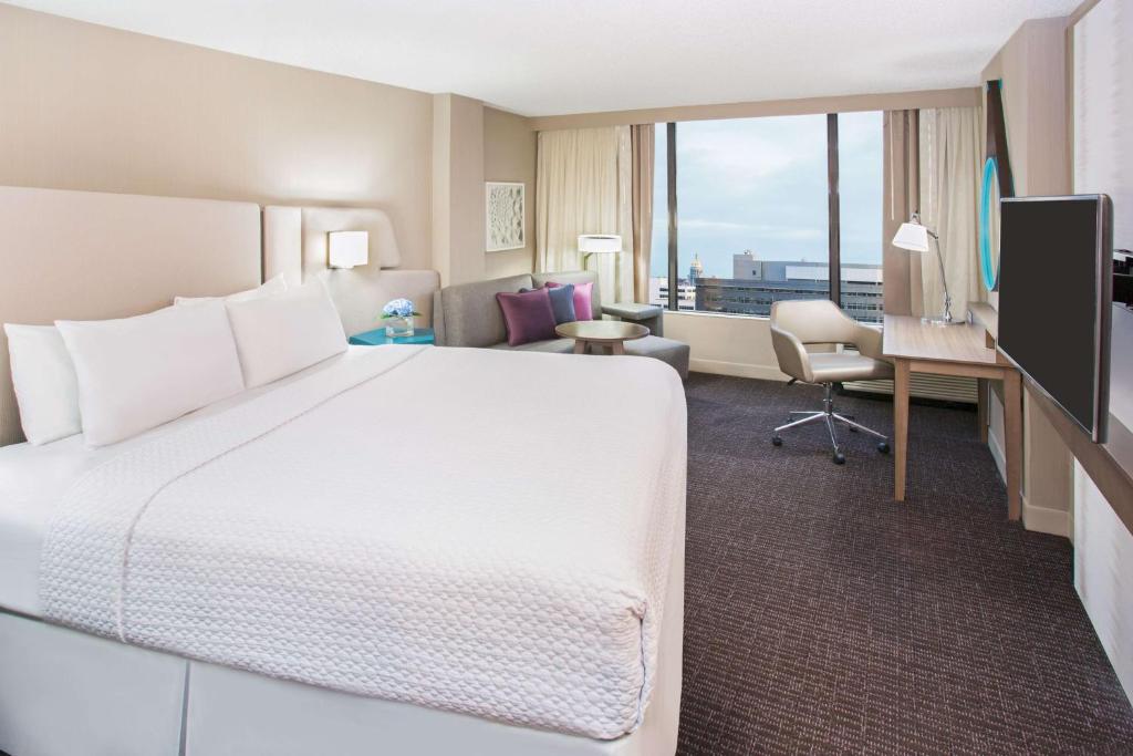 Sonesta Denver Downtown Bedroom with large TV