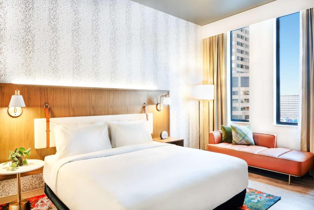 Hyatt Centric Downtown Denver Room with bed and sofa by the window